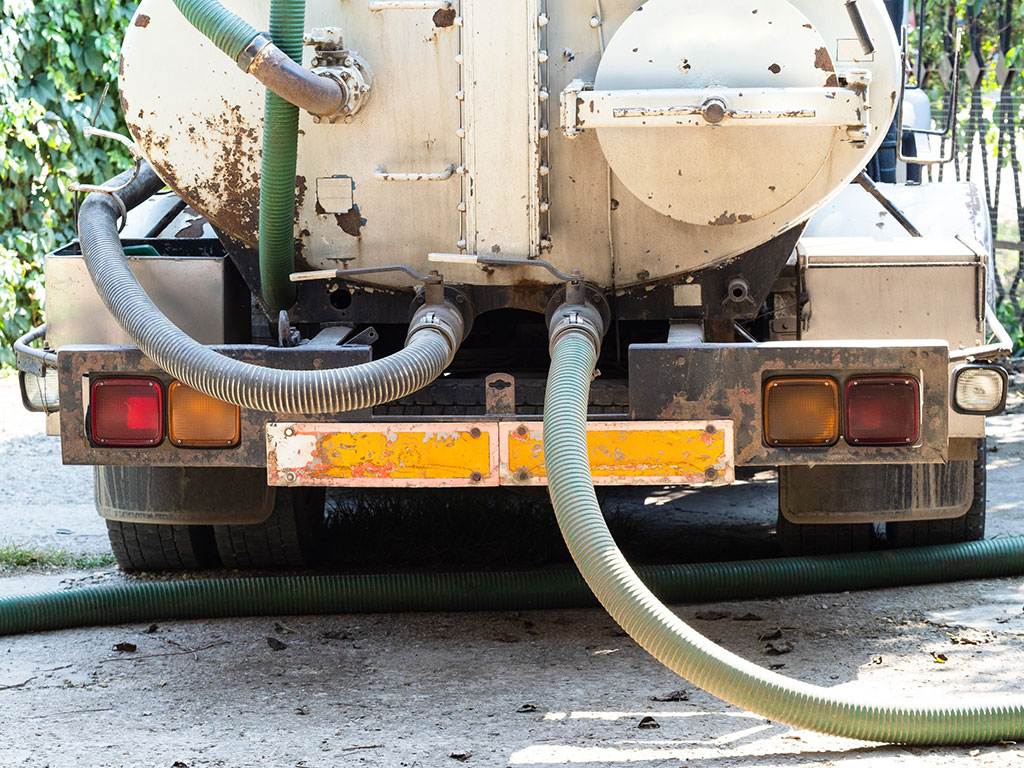 A Sewage Truck Empties A Septic System