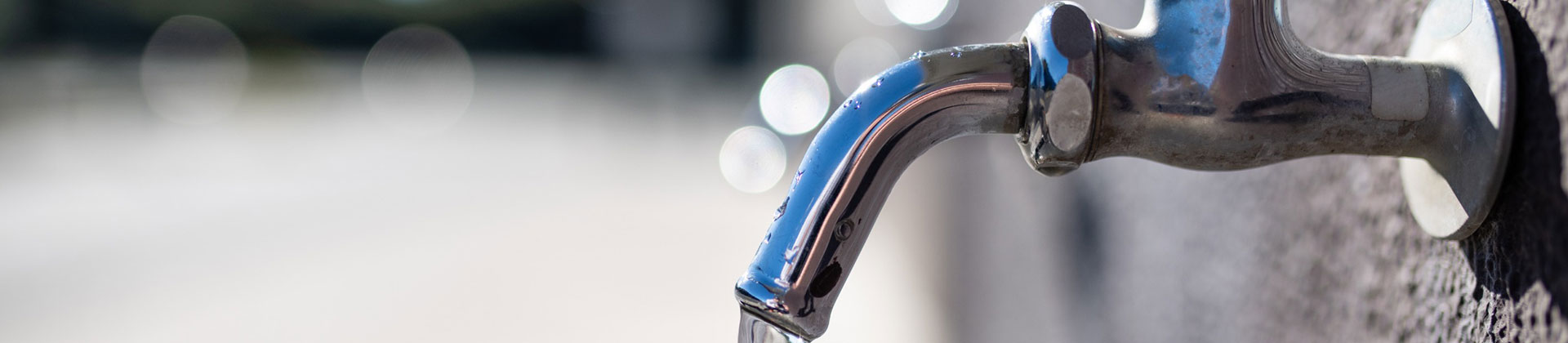 Closeup of Outdoor Water Faucet Running